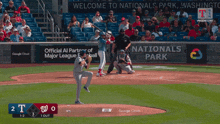 a baseball game is being played in front of a google cloud banner
