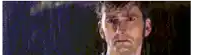 a close up of a man 's face with a blurry background