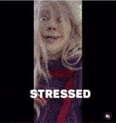a woman is making a funny face with the word stressed behind her
