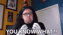a man wearing glasses and a wig says " you know what "