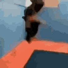 a blurred image of a person jumping in a pool
