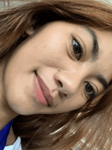 a close up of a woman 's face with long hair