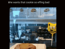 a picture of a cookie and a lollipop with the caption she wants that cookie so effing bad