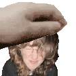 a hand is holding a woman 's head with a knife .