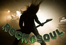 a man is playing a guitar in front of a sign that says rock 4 soul