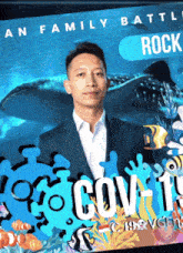 a man in a suit stands in front of a poster that says an family battle