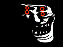 a troll face with red eyes and teeth in the dark