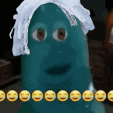 a blue cartoon character with a white lace headband and a bunch of smiley faces around it .