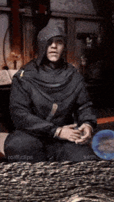 a man in a hooded cloak sits in a room with the words " seth.clips " on the bottom
