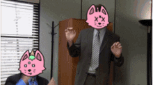 a man in a suit with a pink cat face on his face