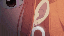 a close up of a person 's ear with a white ring in it