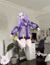 a girl in a purple jacket is jumping in the air in a room