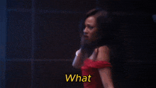 a woman in a red dress is saying f * ck ?