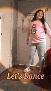 a girl is dancing in a room with the words let 's dance written on the floor