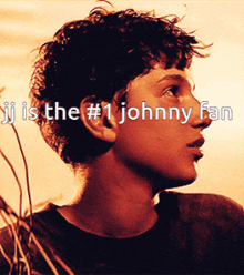 jj is the # 1 johnny fan written over a picture of a young boy