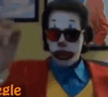a close up of a person wearing a clown makeup .