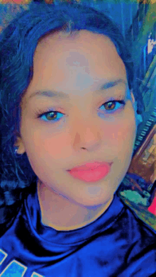 a girl wearing a blue shirt that says ' ucsd ' on it