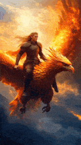 a woman is riding on the back of a fire phoenix