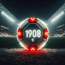 a red and white soccer ball with the year 1908 on it