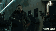 a man in a suicide squad costume stands in front of a building