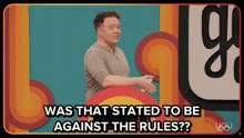a man stands in front of a poster that says was that stated to be against the rules