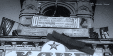 a black and white photo of a building with a sign above it that says hakushin channel