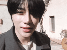 a close up of a person 's face with the sun shining on his face