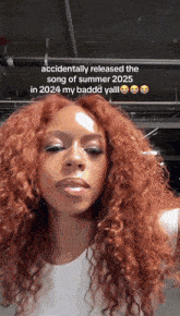 a woman with red hair and a caption that says accidentally released the song of summer 2025 in 2024 my badddd yall