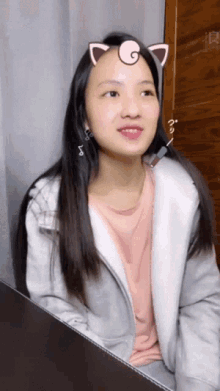 a woman with a cat ear on her head