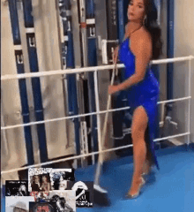 a woman in a blue dress is standing on a balcony holding a broom
