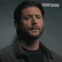 a close up of a man 's face with the word countdown on the bottom