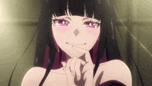 a girl with black hair and purple highlights is smiling with her hand on her chin