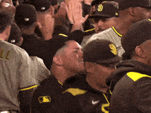 a san diego padres baseball player is surrounded by fans