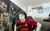a man wearing headphones and a shirt that says ' digitalbits ' on it