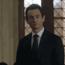 a man in a suit and tie is wearing a kippah .