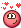 a pixel art smiley face with hearts around it