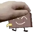 a hand is holding a chocolate bar with a smiling face and arms and legs .