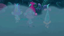 a group of trolls standing next to each other in a dark forest