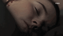 a close up of a woman 's face with the word max on the bottom right