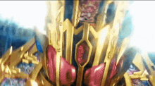 a close up of a gold and red object that looks like a robot