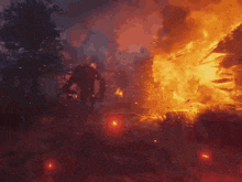 a painting of a man standing in front of a fire at night