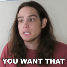a man with long hair is making a face and says you want that