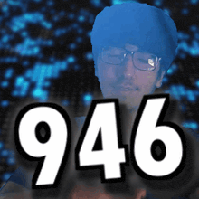 a picture of a man with glasses and the number 946 behind him