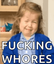 a little girl in a blue sweater is crying with the words fucking whores below her