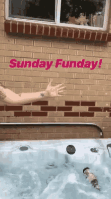 a person in a hot tub with the words " sunday funday " on the bottom