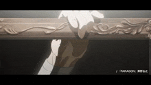 a close up of a person 's hand holding a wooden plank