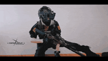 a person in a destroy cosplay costume is holding a rifle