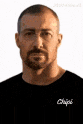 a man with a beard and glasses is wearing a black shirt with the name chipi on it