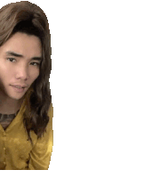 a man with long hair and a yellow shirt is looking at the camera