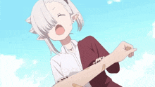 a girl with a bandage on her arm is being held by someone